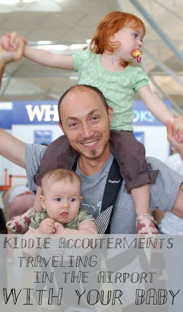 Two kids and dad in the airport smiling