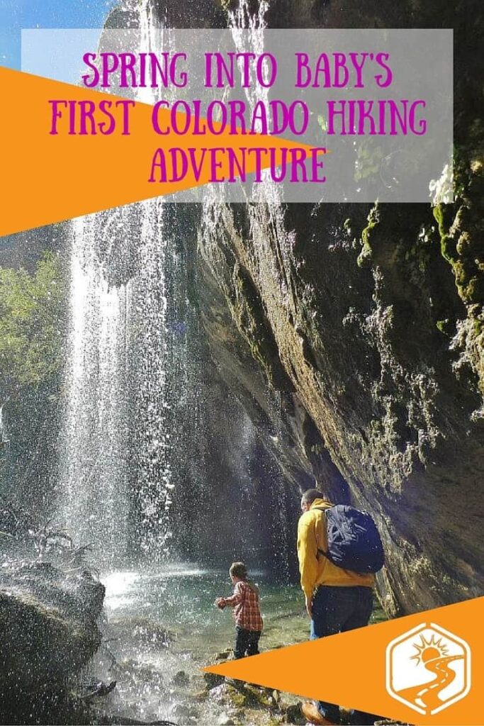 father and son touching the waterfall at Hanging Lake in Glenwood Springs, Colorado