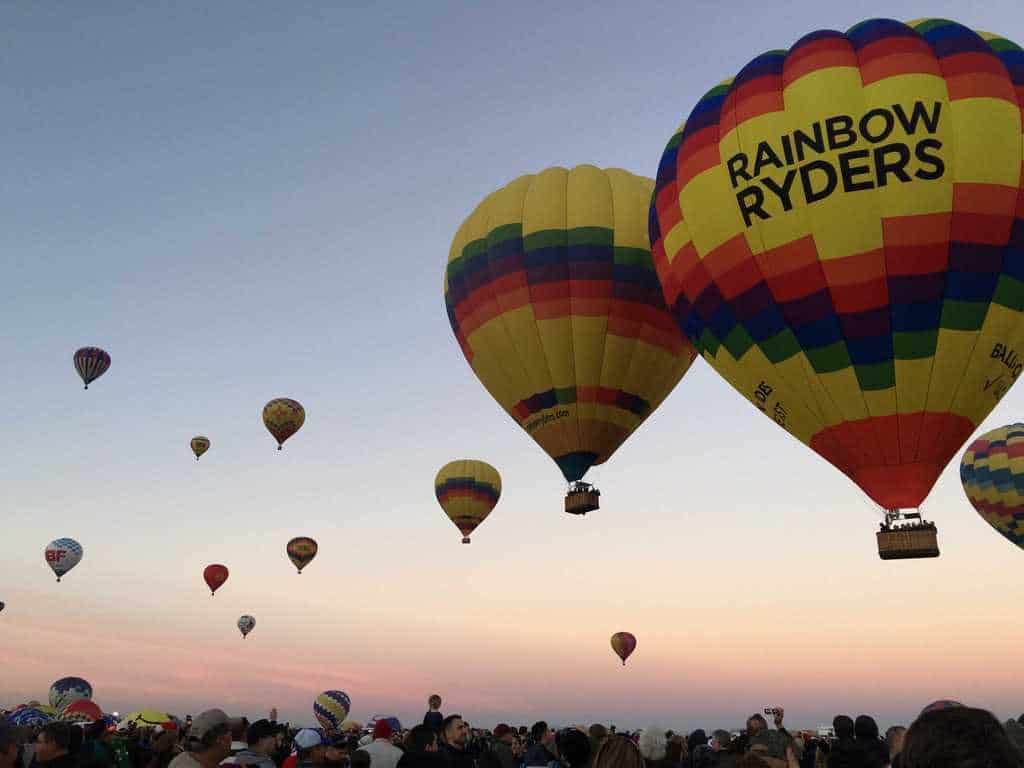 balloons taking off in the morning at the Albuquerque International Balloon Fiesta