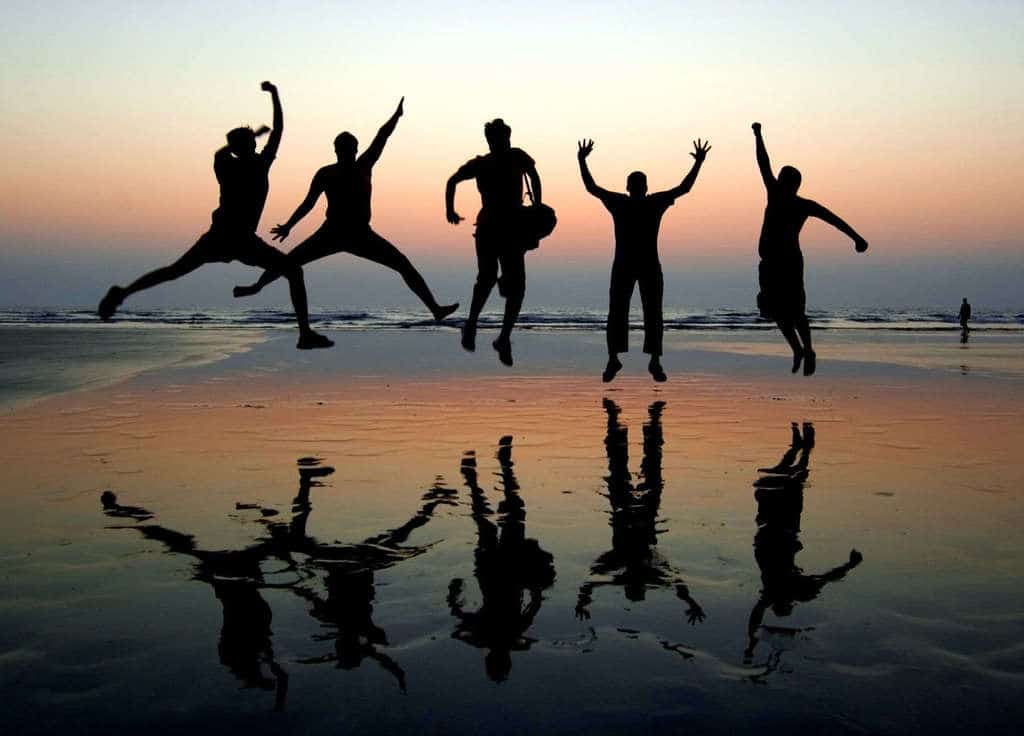 Men jumping at sunset on the beach by slalit on Flickr