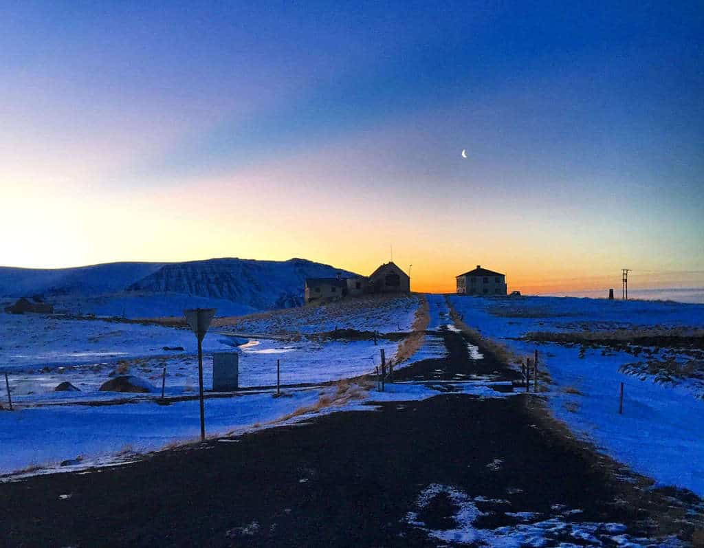 road covered in snow in iceland at dawn