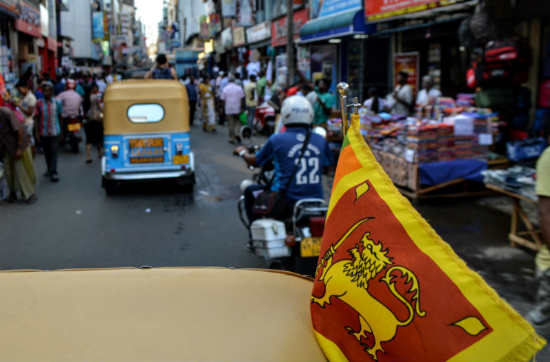 yuk tuk ride and sri lanka flag in colombo sri lanka by eileen cotter wright