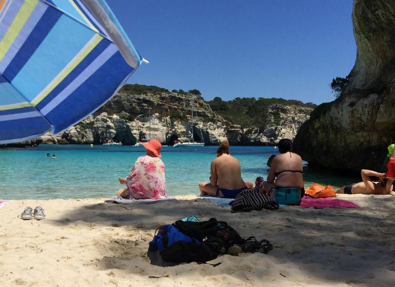 sunbathers Cala Macarelleta menorca