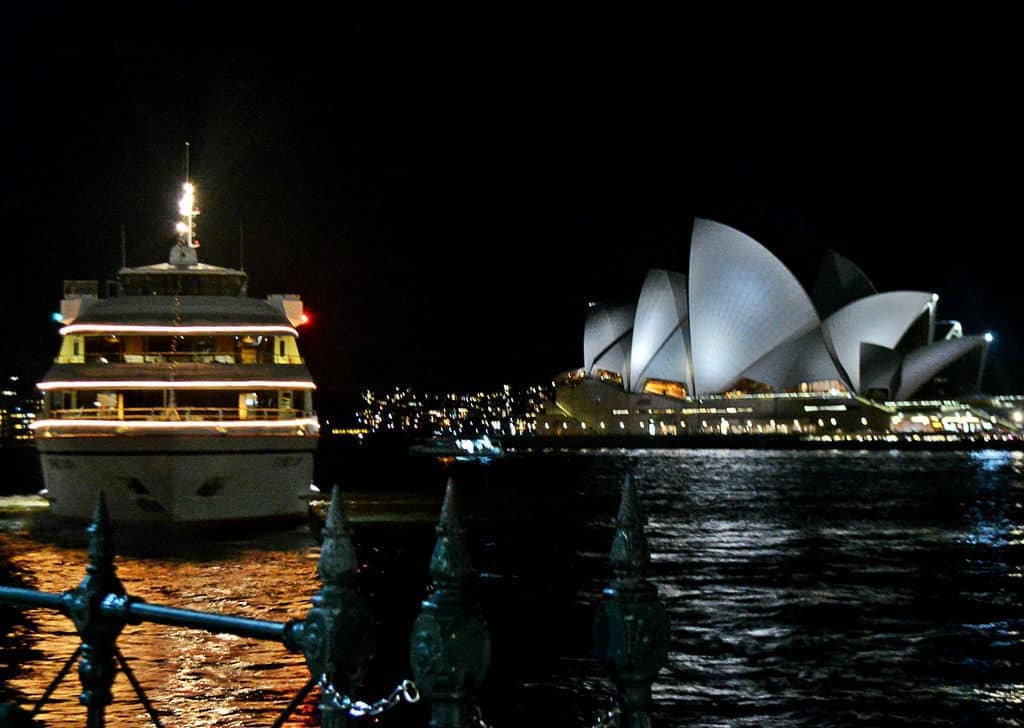 sydney opera house and ferry boat at night Australia