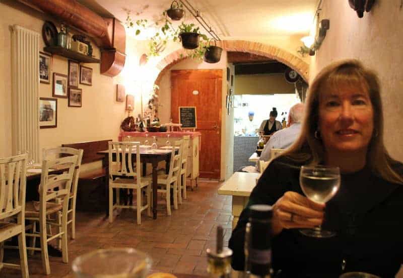 dinner with wine in cellar siena italy