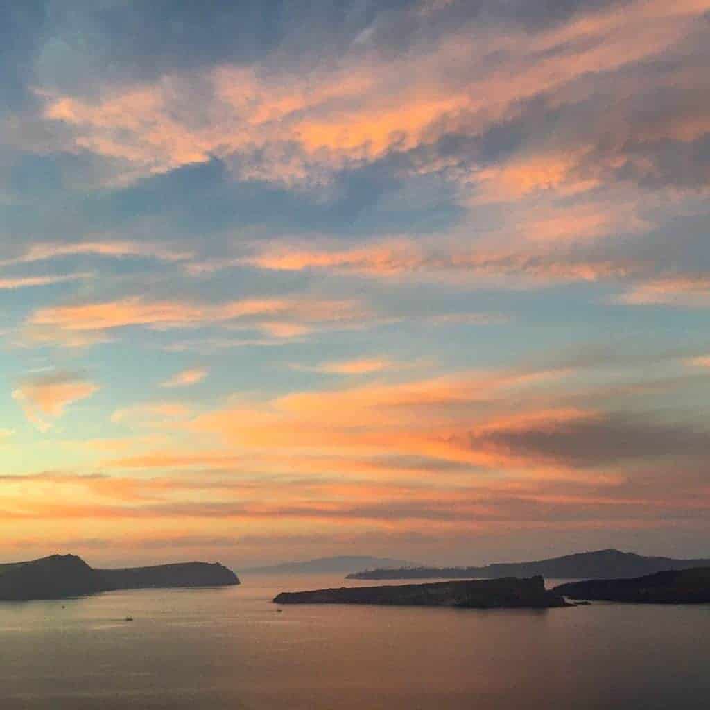 santorini sunset with pink, blue and orange