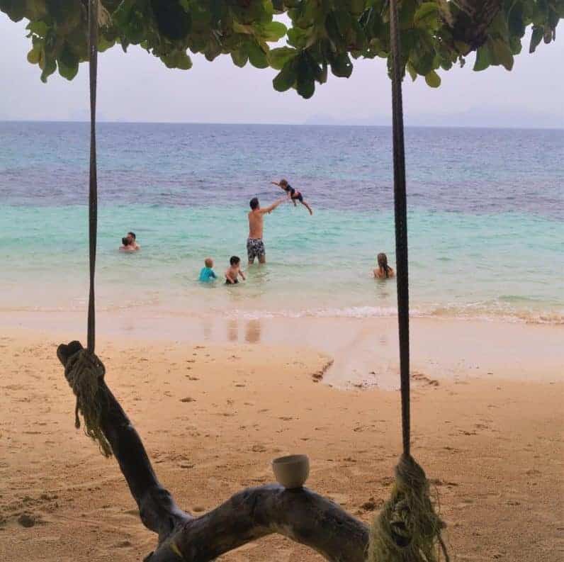 Jenny from Travelynn with group travel family on beach in Koh Lanta Thailand