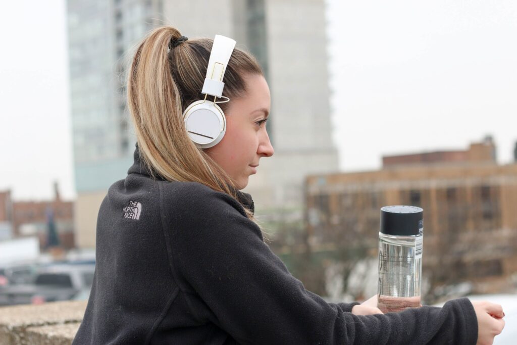 woman with white headphones